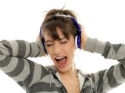 girl with headphones singing with all her heart to the music.